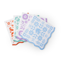 bright fiesta paper napkins with colorful floral designs and scalloped edges
