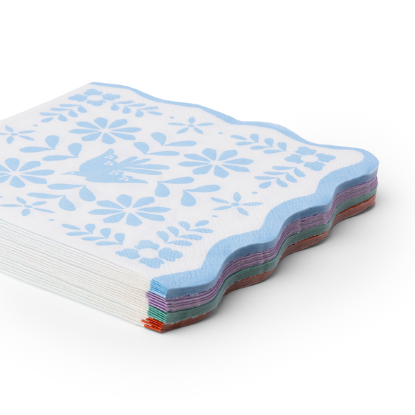 stack of bright fiesta large paper napkins showing multicolor layered edges