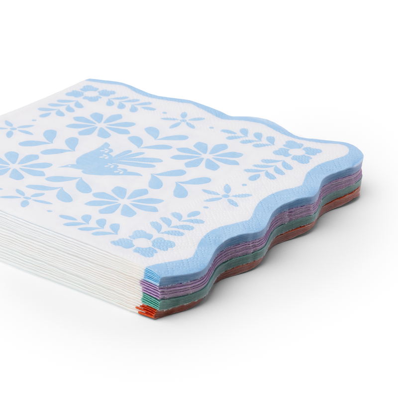 stack of bright fiesta large paper napkins showing multicolor layered edges