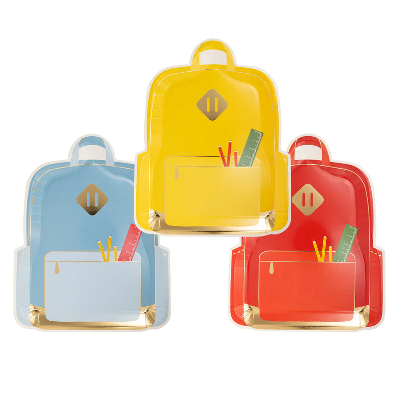 three backpack-shaped plates in red, yellow, and blue arranged on a white background