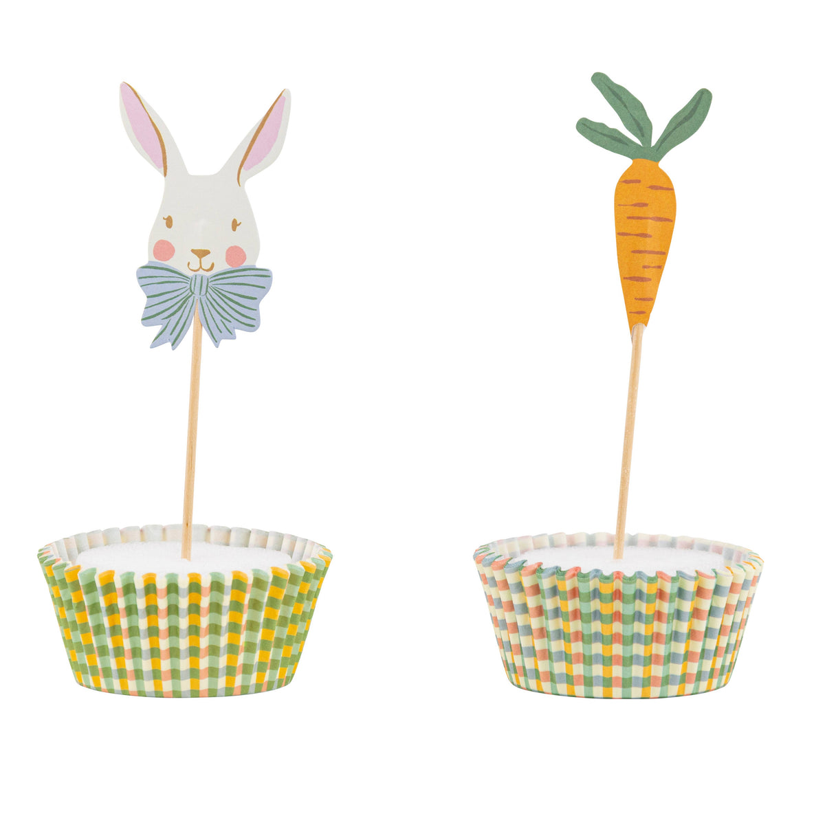 Close-up of a white bunny with a blue bow and an orange carrot cupcake topper in gingham liners, perfect for spring garden party decorations.