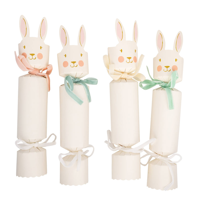Set of Easter bunny party crackers with pastel ribbon bows on white background