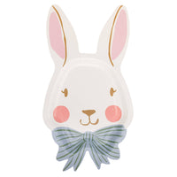 Bunny face shaped paper plate with pink ears and blue bow on white background