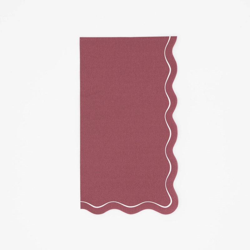 Solid burgundy fall guest towel in deep wine with a wavy scalloped cream-outlined edge, flat view on white background.