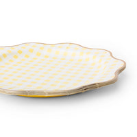 Butter yellow gingham scalloped dinner plate shown at an angle