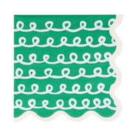 Close-up of green Frosting Cocktail Napkin with white looping frosting pattern and scalloped edge.