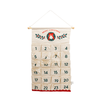 Cream canvas Christmas advent calendar banner with 24 numbered pockets, wreath design, and red scalloped hem