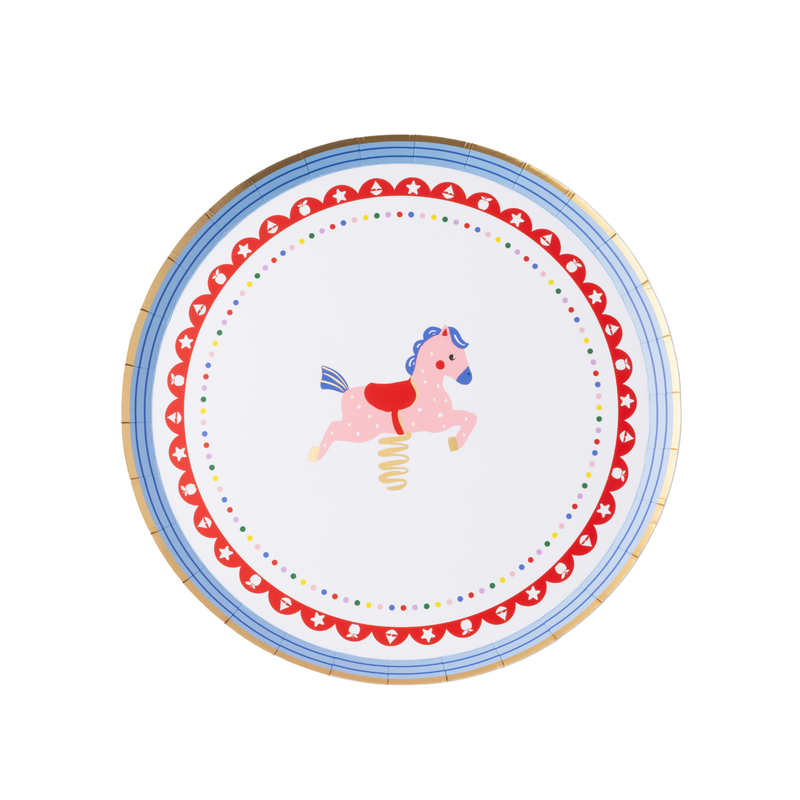Single Petite Playground carousel horse paper cake plate on white background showing pink spring carousel horse with blue mane and red saddle, gold foil spring, red scalloped border with white toy iconography, multicolor confetti dot ring, blue concentric stripe border, and gold foil rim