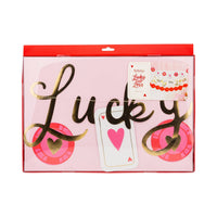 close-up of a gold foil "Lucky" banner piece for a Casino Theme Bachelorette.