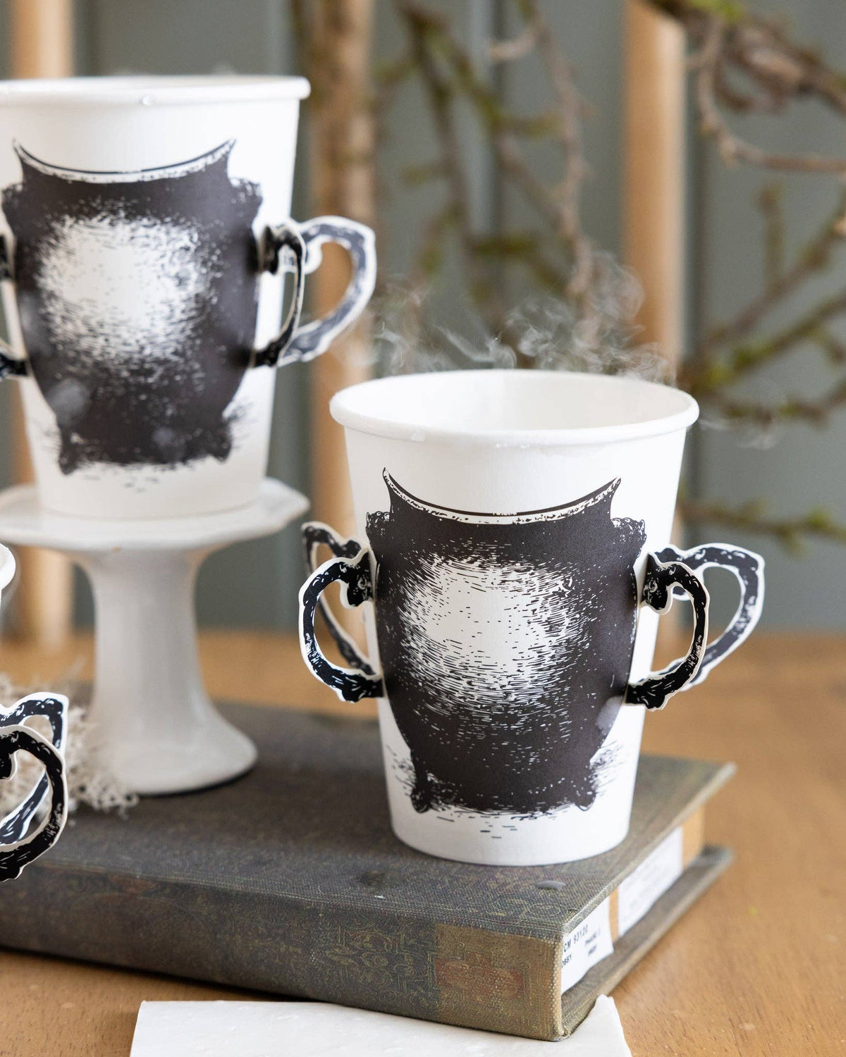 Close detail of an adhesive handles on the cauldron cups. 