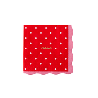 Single red polka dot celebrate paper cocktail napkin flat lay showing white dots, gold foil celebrate script, and pink scalloped edge on white background