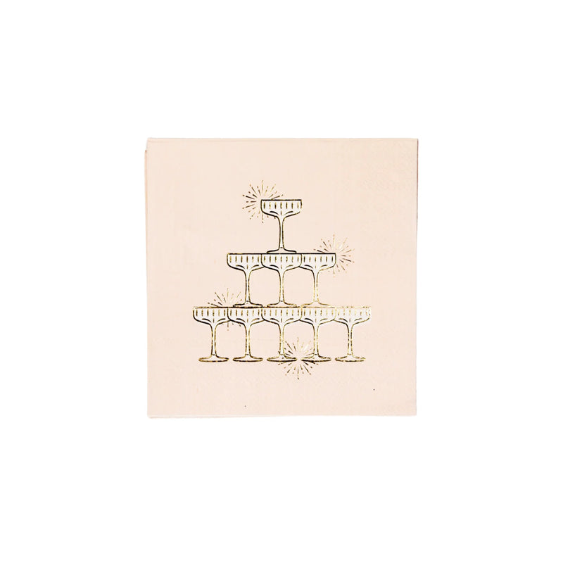 Single blush cocktail napkin printed with a gold foil champagne tower of stacked coupe glasses and sparkle accents on a white background