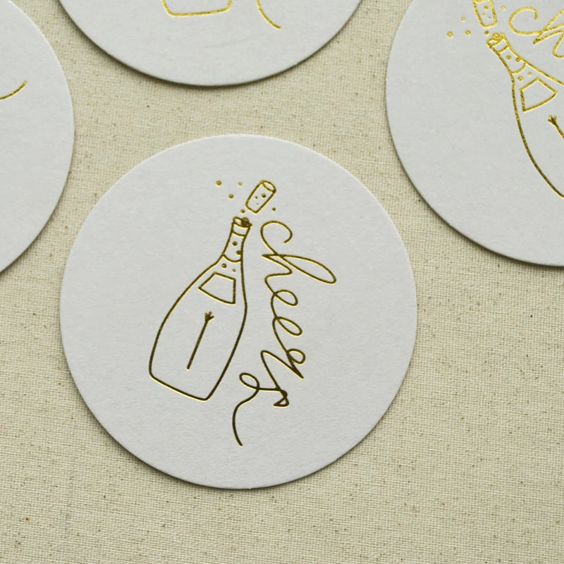 Close-up of Cheers Champagne Coaster with gold foil detail—perfect for a Cheers to Forever toast.