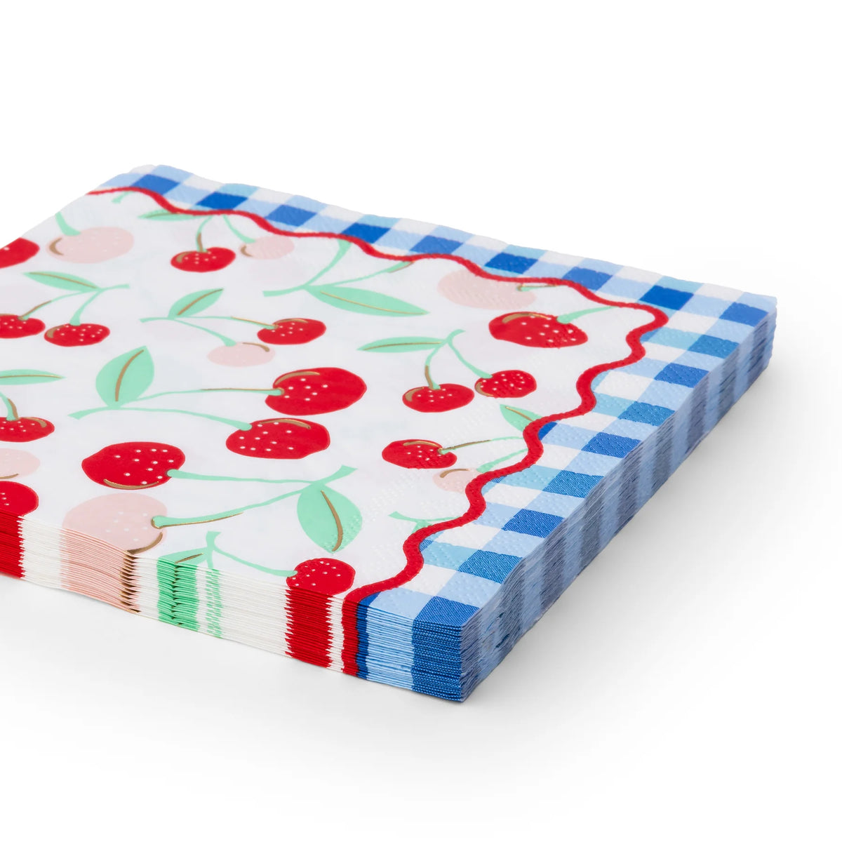Stack of cherry print paper lunch napkins with gold-foil cherries, mint leaves, a red rickrack edge, and a blue gingham border.