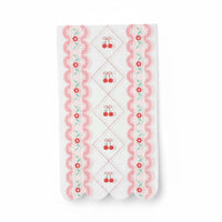Single white luncheon napkin with red cherries and a pink scalloped floral edge