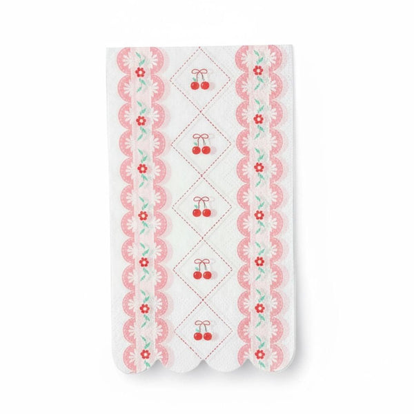 Single white luncheon napkin with red cherries and a pink scalloped floral edge
