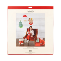 Back of package showing child scene with Santa, reindeer, and tree Christmas hanging decorations