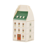 Cream house-shaped advent box with a green roof, oval dormer windows, and a red front door with a wreath