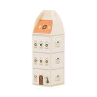 Tall cream townhouse advent box with a peach roof, arched windows, and a wreath on the front door