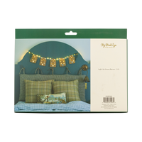 Back of the light-up house banner packaging with a styled bedroom photo.