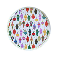 Round white Christmas ornament paper plate with an all-over vintage ornament pattern in reds, greens, blues, pinks, and gold, overhead view on white background.