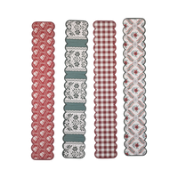 4 scalloped paper chain strips in red floral, green floral stripe, red gingham, and red floral trellis Christmas patterns