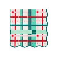 Single scalloped Christmas plaid napkin with red, green, and pink holiday plaid design.