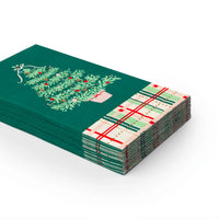 Stack of scalloped Christmas paper napkins with green tree print and plaid trim.