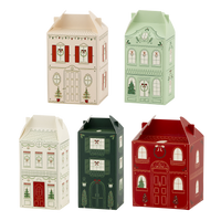 Five house-shaped Christmas advent treat boxes grouped together in cream, green, and red village designs
