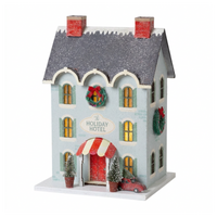 Blue glitter Holiday Hotel putz house with silver roof, wreaths, striped awning, and red car with tree