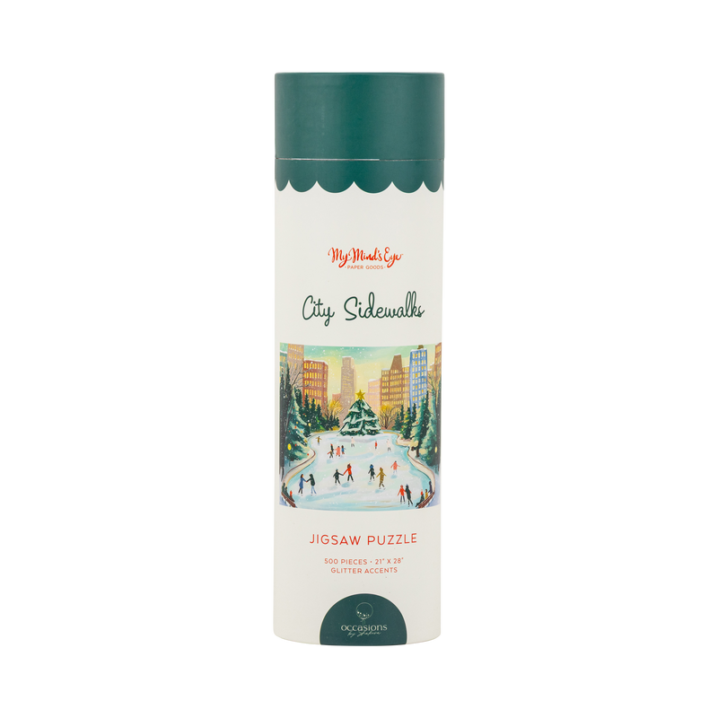 City Sidewalks 500 piece jigsaw puzzle tube with a colorful city ice skating illustration and glitter