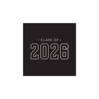 A square black paper napkin with "Class of 2026" printed in a white block-style font for a commencement celebration.