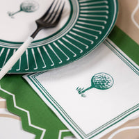 Close-up of golf beverage napkin on party table