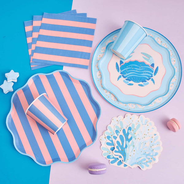 Coastal Catch table setting with crab plate, striped cups and napkins