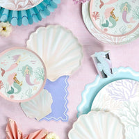 coastal dessert plates styled with mermaid tableware and shell plate.