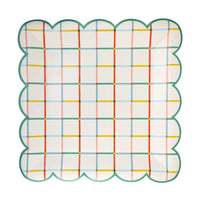 Colorful grid scalloped paper plate front view.