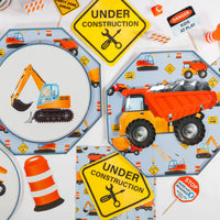 construction themed table setup with plates and party supplies
