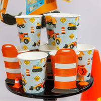 construction themed cups on party table with barricades and decor