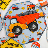 construction plate with dump truck and under construction signs