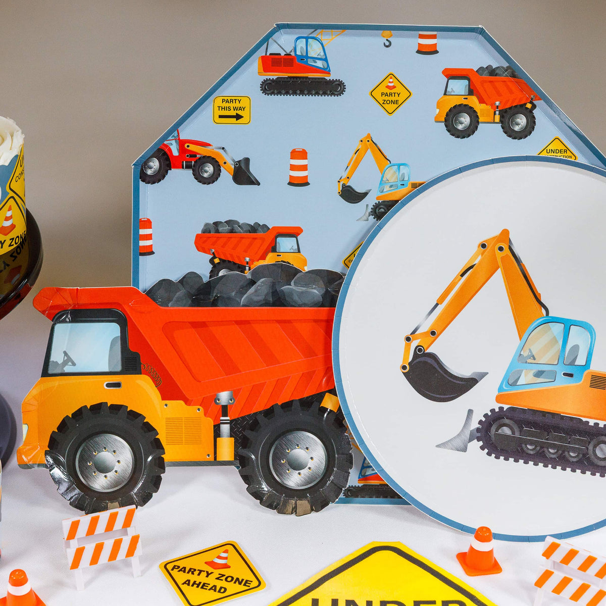 construction party table with plates and themed decorations