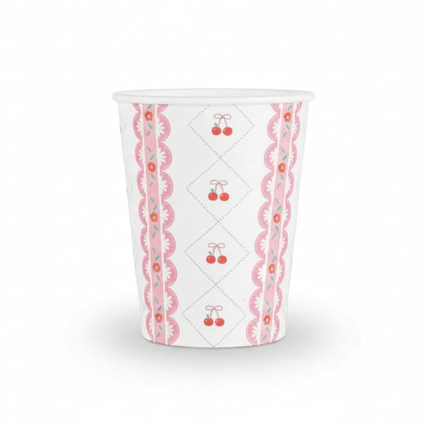 Single paper cup featuring a pink lace border and red cherry bow pattern