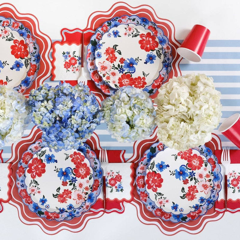 A 4th of July table setting featuring Large Summer Dinner Plates and blue hydrangea centerpieces.