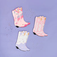 Three cowgirl boot plates in pink and purple with foil accents on lavender background—set includes four designs