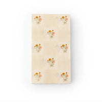 Single guest towel, front view, with alternating check and floral blocks.