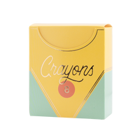 Single assembled closed crayon box-shaped treat box on white background. Fully constructed yellow and mint green box with flip-top lid open slightly. Gold foil "Crayons" script, orange circle badge with "8," silver/gold foil accent lines visible.