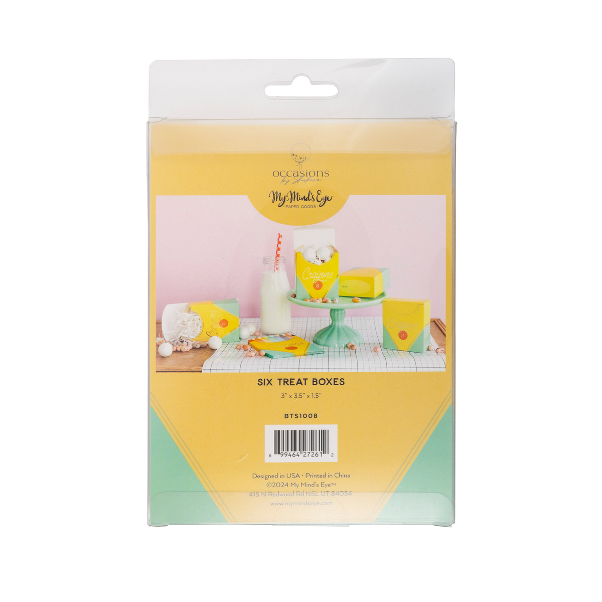 Front of retail packaging for six crayon box-shaped treat boxes. Clear plastic sleeve with yellow and mint green header card showing the assembled boxes styled with a glass milk bottle, candy, and a mint green cake stand against a pink background. Header reads "Six Treat Boxes / 3" x 3.5" x 1.5" / BTS1008."