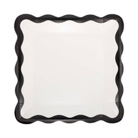 Cream square paper plate with black scalloped border.
