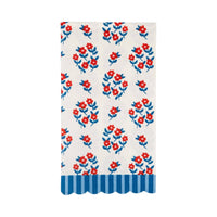 Single cream floral paper dinner napkin flat lay showing red flowers with blue leaves and blue striped scalloped edge