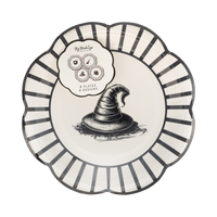 A witchy decorative plate accented by a black-and-white striped edge and a central witch hat graphic.
