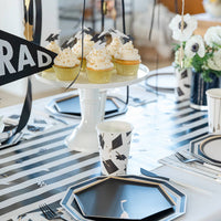 Cupcake display with hanging graduation hat garland
